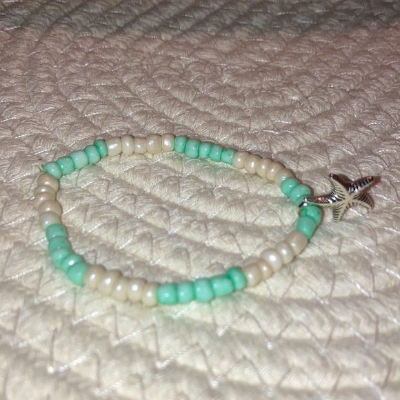 Other - One white and blue bracelet with a silver starfish charm